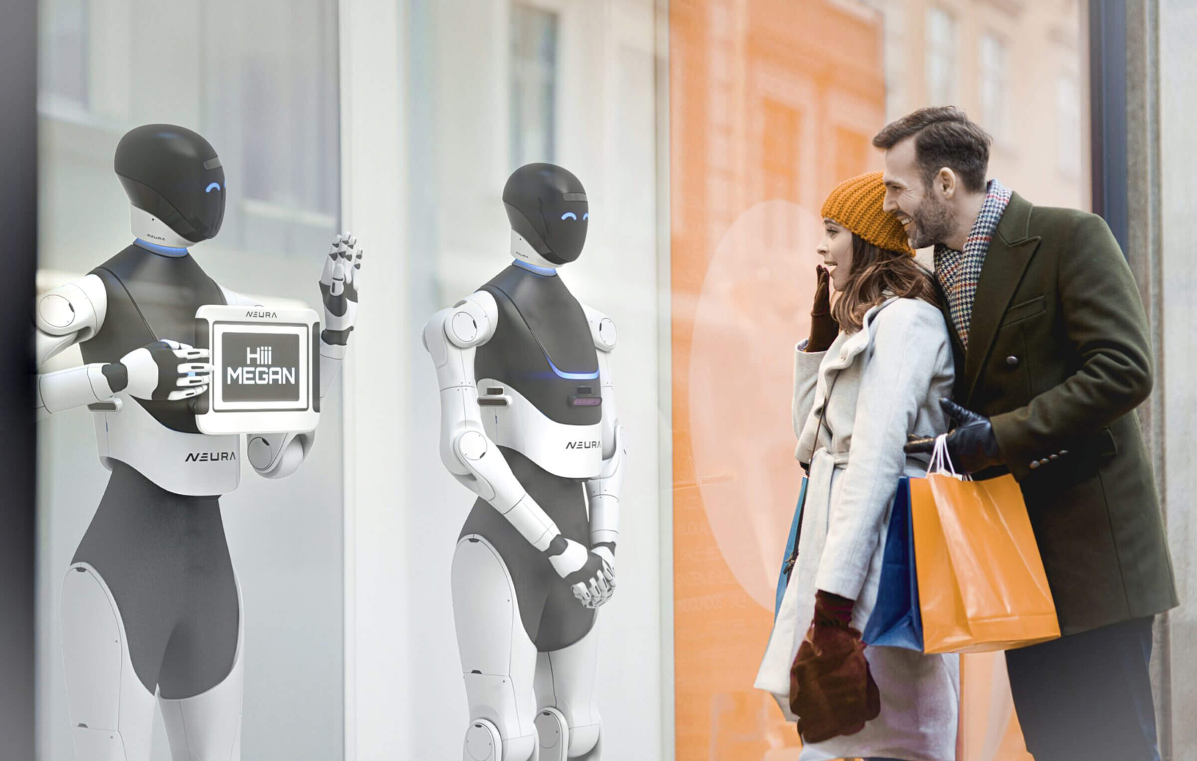 Two people in front of a shop window with robots.